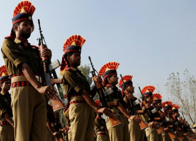 Indian police take part in a ceremony to